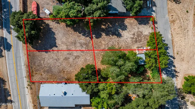 a view of street with parked cars