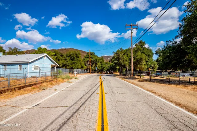 a sign on the side of a road