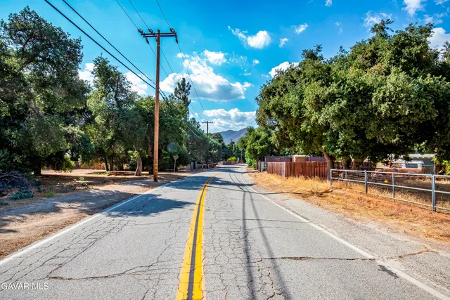 a view of a backyard with mountain view