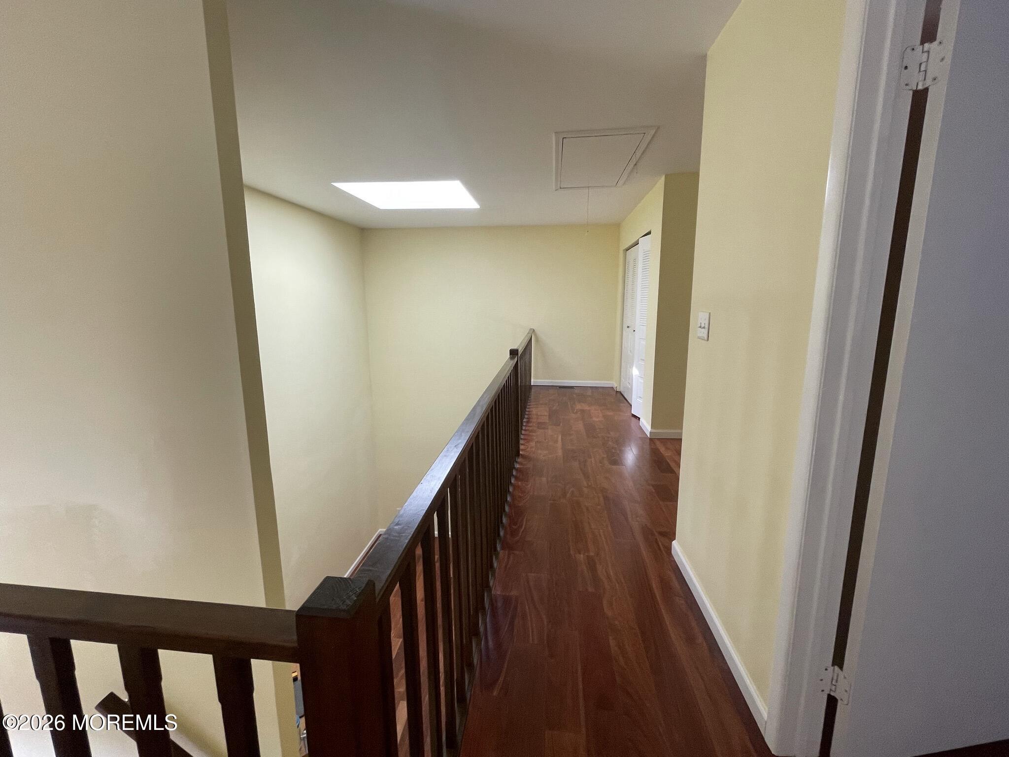 19 Clavendon Court Middletown, NJ 07748 - Photo 14 of 21 a view of a hallway with wooden floor and stairs