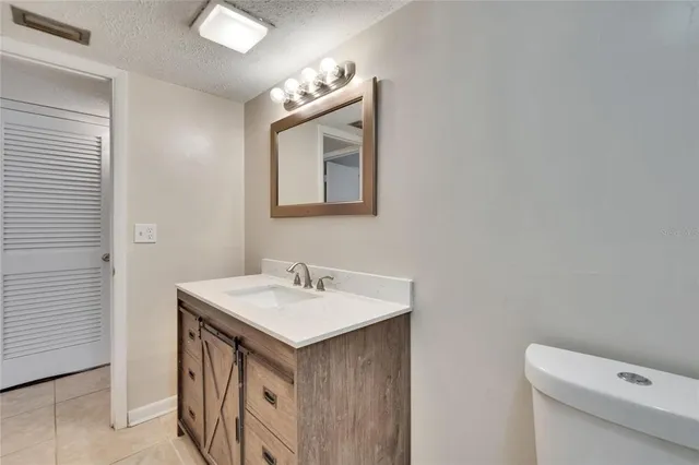 a view of a room with a fan and a window