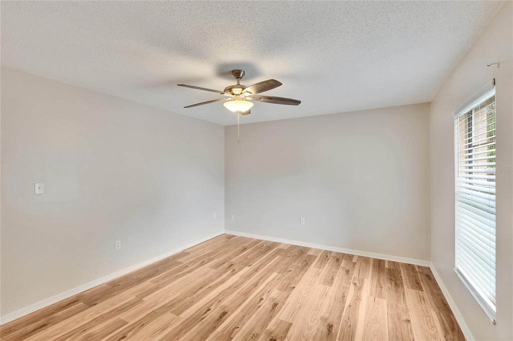 125 Picardy Villa Circle, Unit 100 Brandon, FL 33510 - Photo 21 of 52 a view of a room with a fan and a window