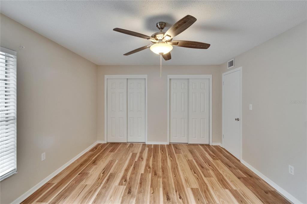 125 Picardy Villa Circle, Unit 100 Brandon, FL 33510 - Photo 22 of 52 a view of a room with a ceiling fan