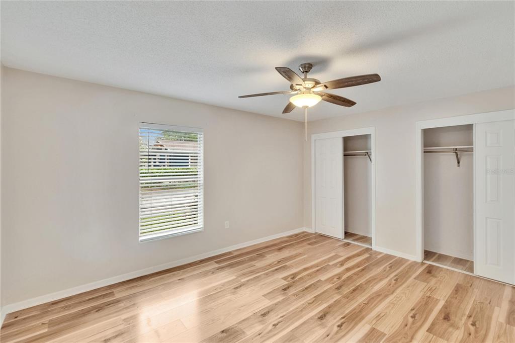 125 Picardy Villa Circle, Unit 100 Brandon, FL 33510 - Photo 24 of 52 a view of a room with a ceiling fan and a window