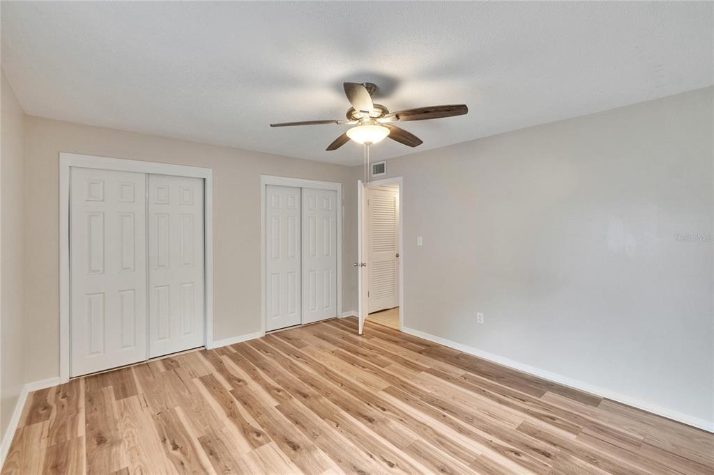 125 Picardy Villa Circle, Unit 100 Brandon, FL 33510 - Photo 27 of 52 a view of empty room with ceiling fan