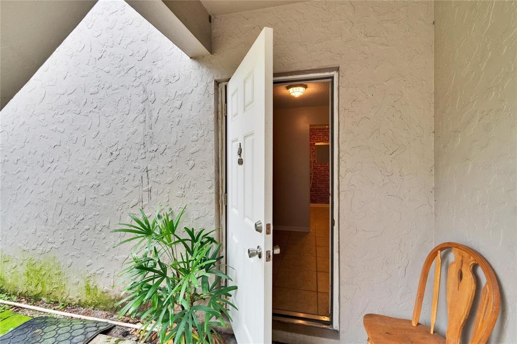 125 Picardy Villa Circle, Unit 100 Brandon, FL 33510 - Photo 29 of 52 a front view of a house with entryway