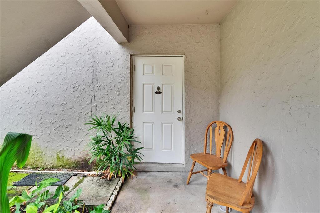 125 Picardy Villa Circle, Unit 100 Brandon, FL 33510 - Photo 31 of 52 a view of a entryway with wooden floor