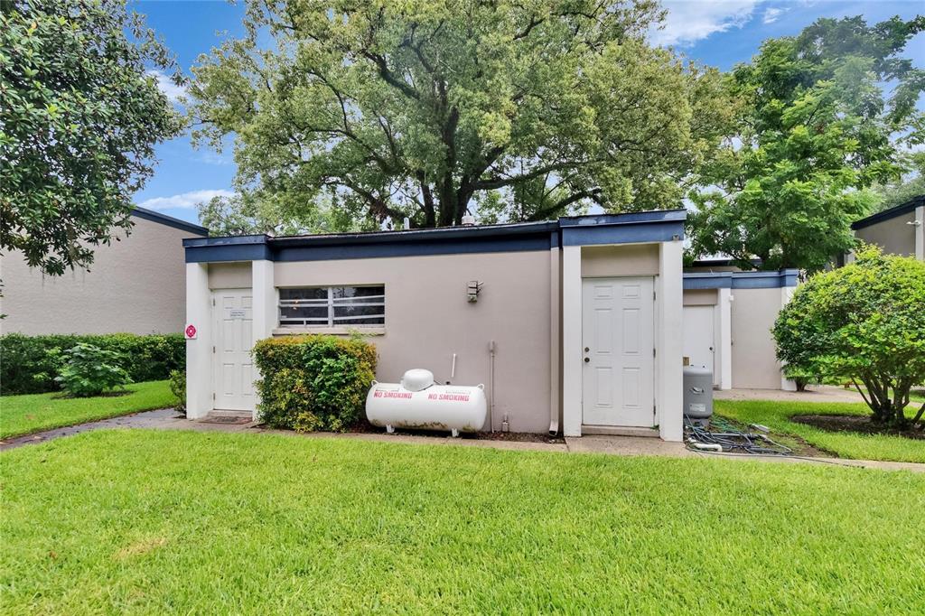 125 Picardy Villa Circle, Unit 100 Brandon, FL 33510 - Photo 33 of 52 a view of a house with backyard