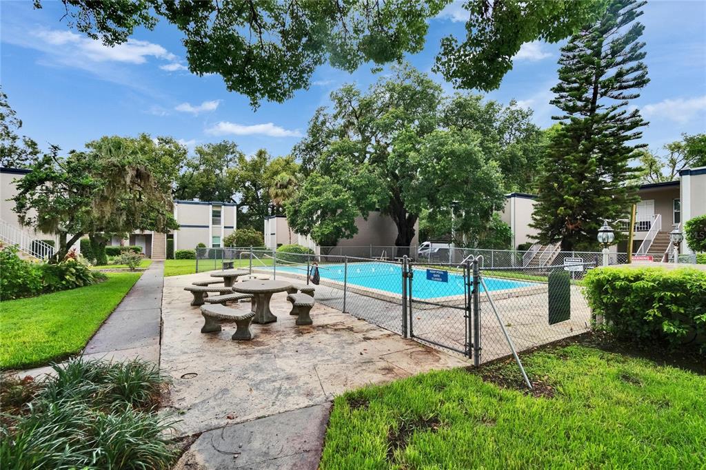 125 Picardy Villa Circle, Unit 100 Brandon, FL 33510 - Photo 36 of 52 a view of a garden with sitting area