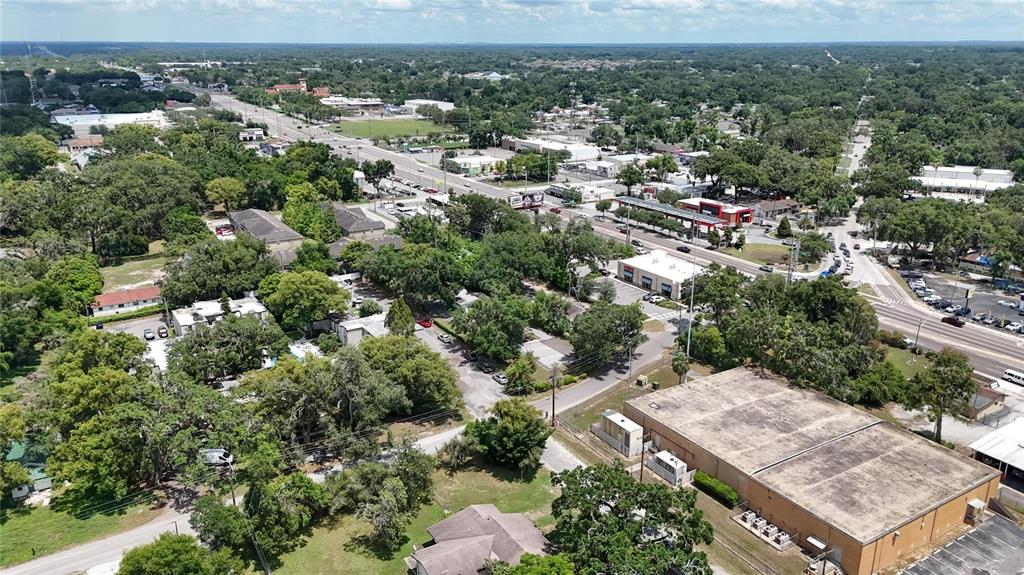 125 Picardy Villa Circle, Unit 100 Brandon, FL 33510 - Photo 47 of 52 an aerial view of a residential houses with outdoor space and trees