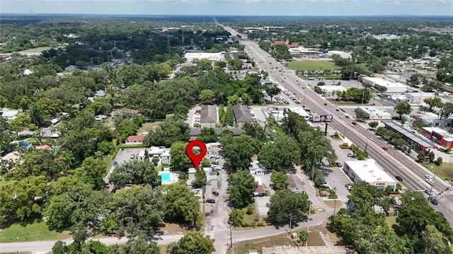an aerial view of a house with outdoor space