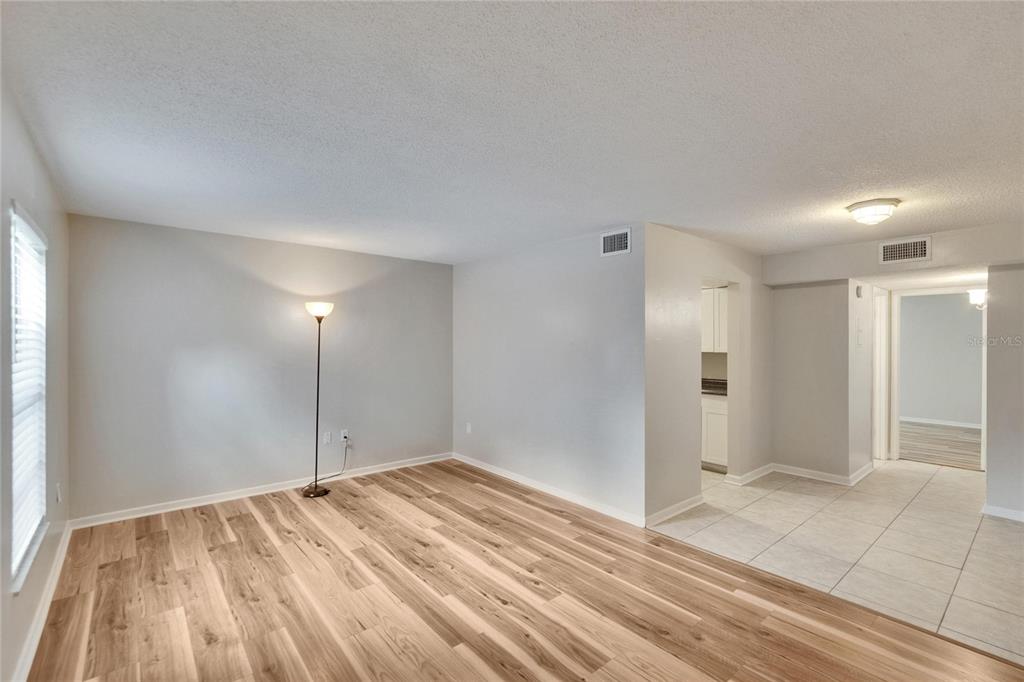 125 Picardy Villa Circle, Unit 100 Brandon, FL 33510 - Photo 7 of 52 a view of an empty room and window