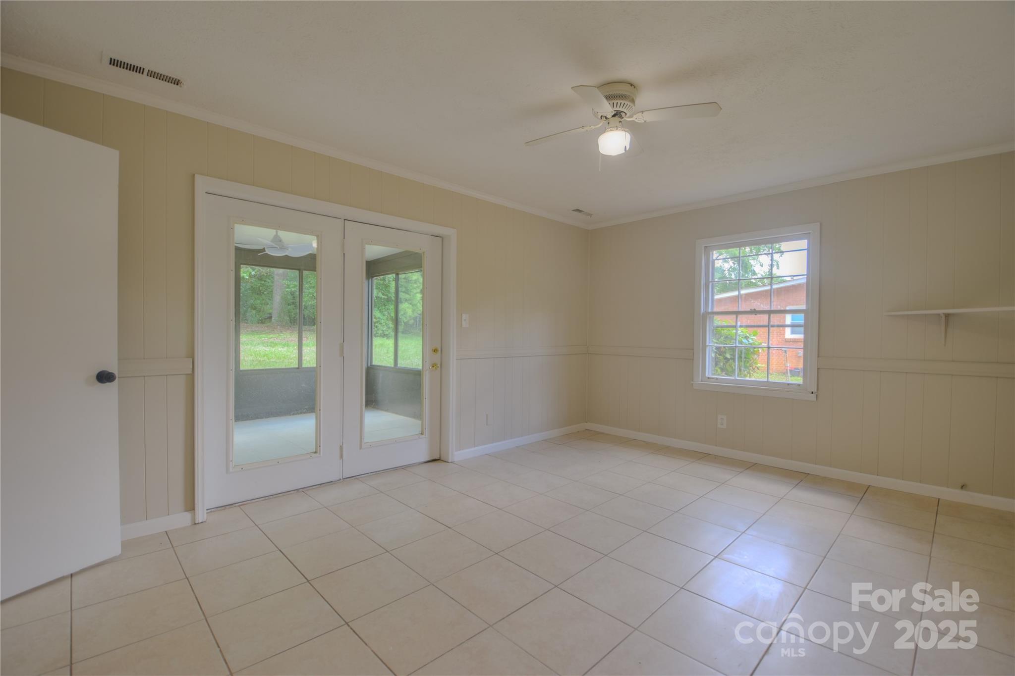 6921 Idlewild Road Charlotte, NC 28212 - Photo 17 of 29 a view of an empty room with a window