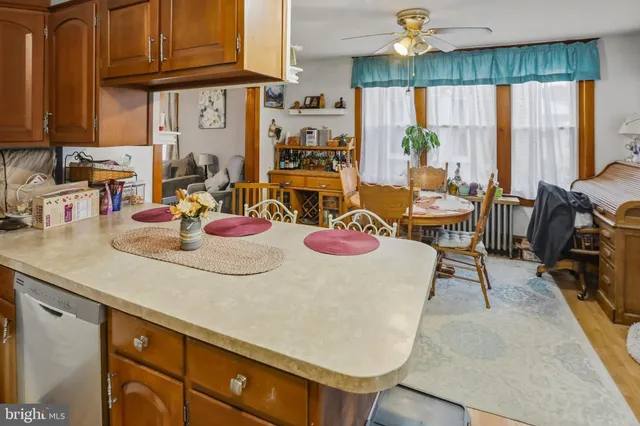 a kitchen with a table and chairs in it
