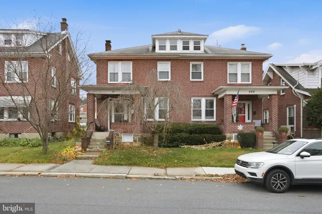 a car parked in front of a house
