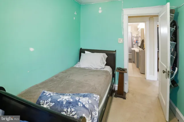 a bedroom with bed and window