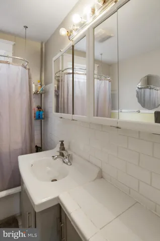 a bathroom with a toilet and a sink