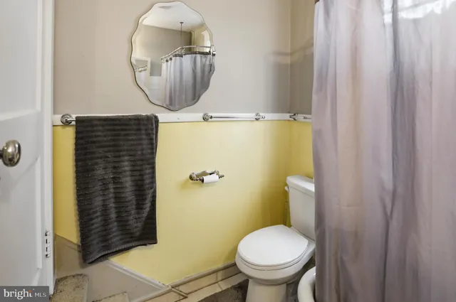 a bedroom with bed and window