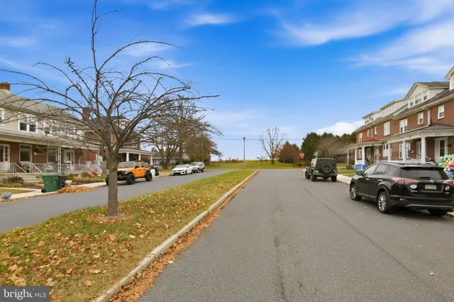 a view of street with parked cars
