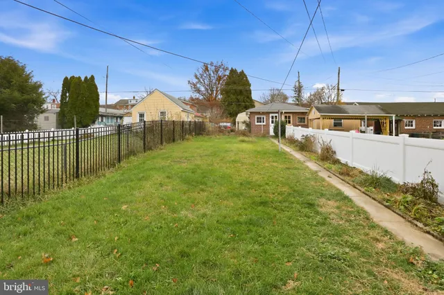 a view of a house with a yard from a balcony