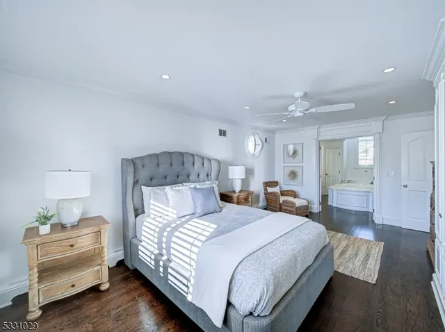 a bathroom with a granite countertop sink a mirror and a vanity