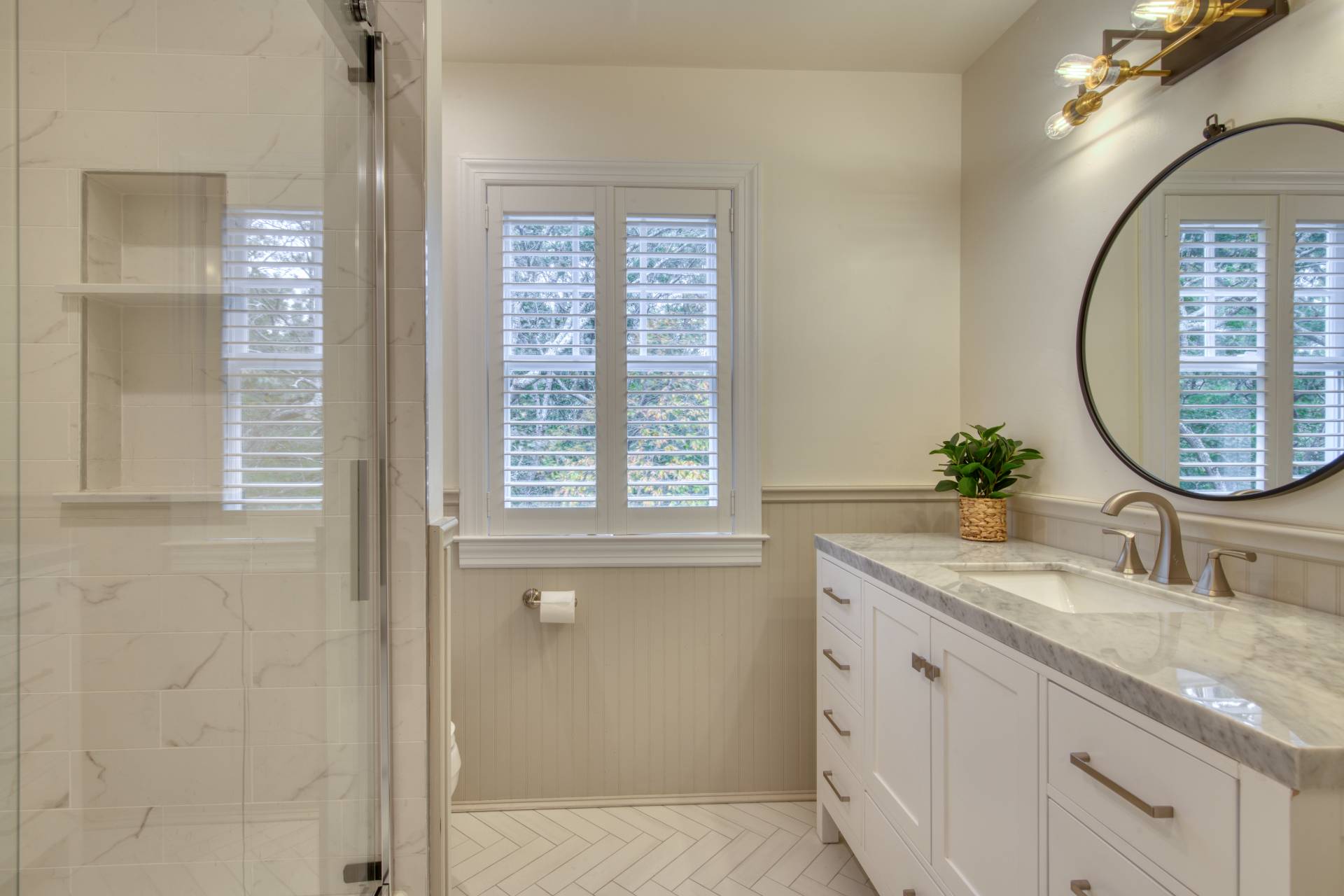 8 Grape Arbor Lane East Hampton, NY 11937 - Photo 11 of 15 a bathroom with a granite countertop sink a mirror and a shower