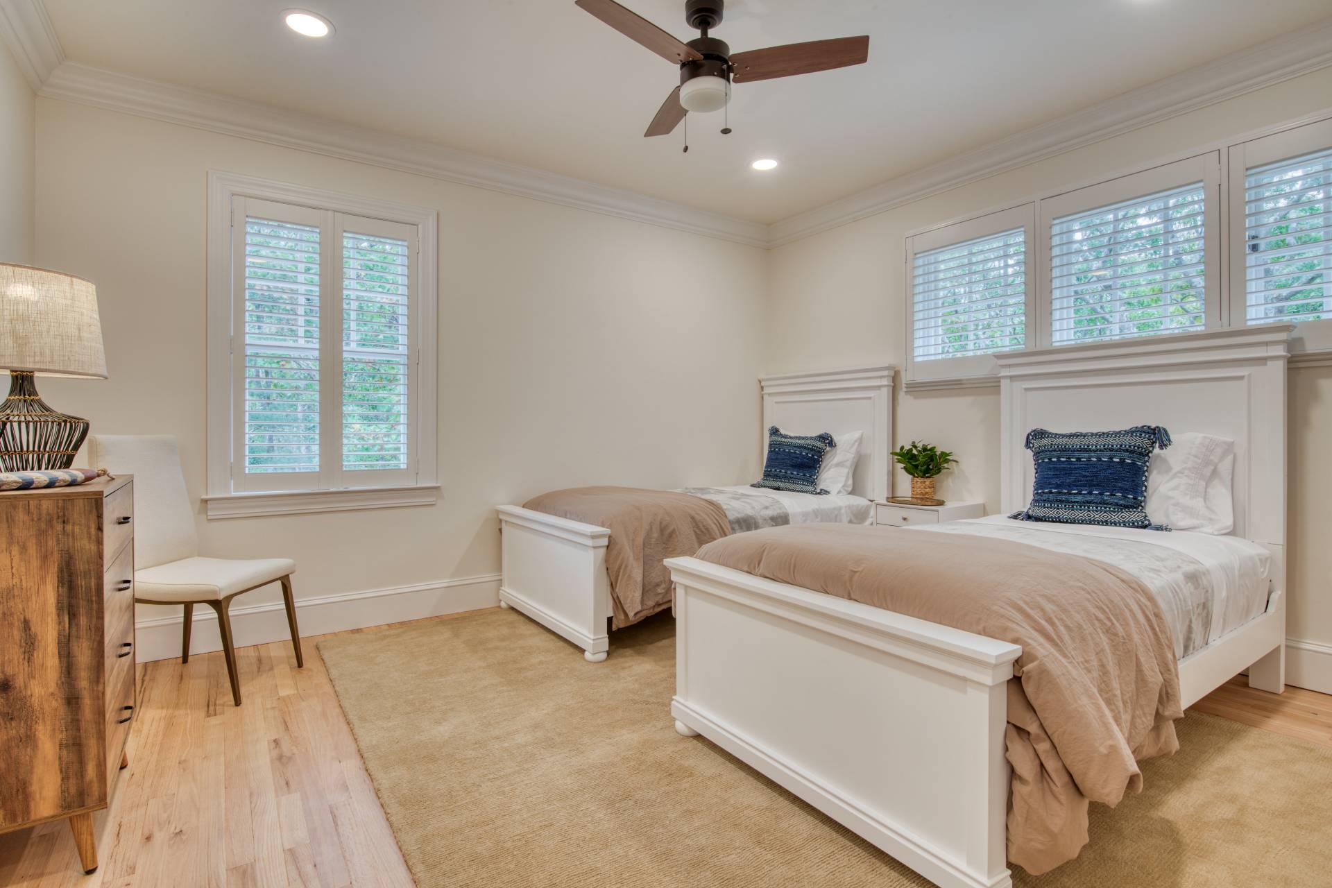 8 Grape Arbor Lane East Hampton, NY 11937 - Photo 13 of 15 a spacious bedroom with a bed and a table