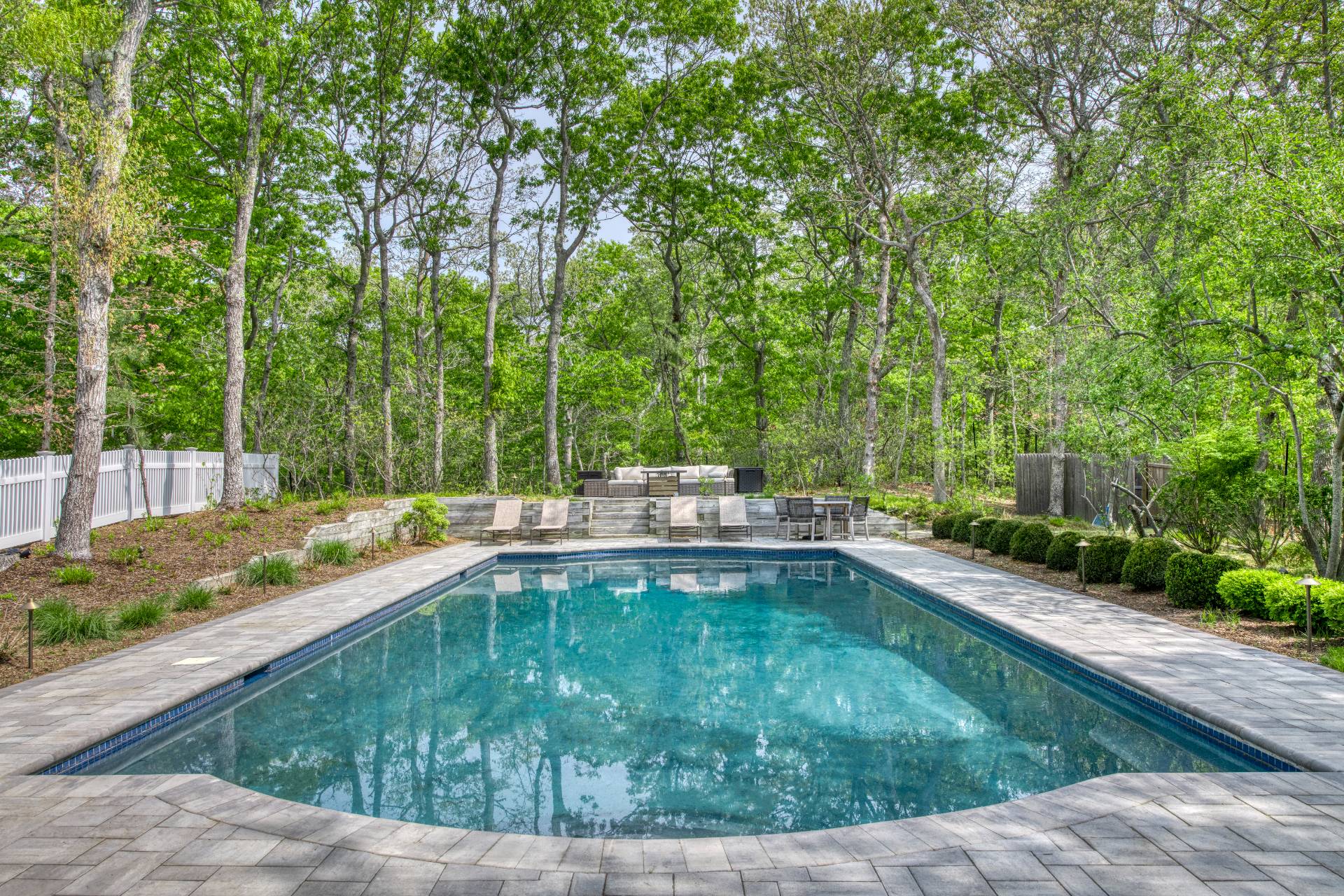 8 Grape Arbor Lane East Hampton, NY 11937 - Photo 15 of 15 a swimming pool with outdoor seating and yard