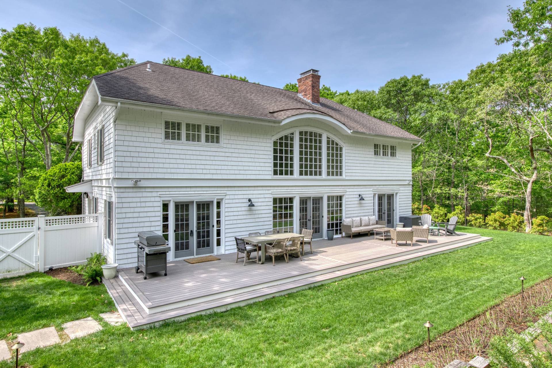 8 Grape Arbor Lane East Hampton, NY 11937 - Photo 2 of 15 a view of a house with a yard and sitting area
