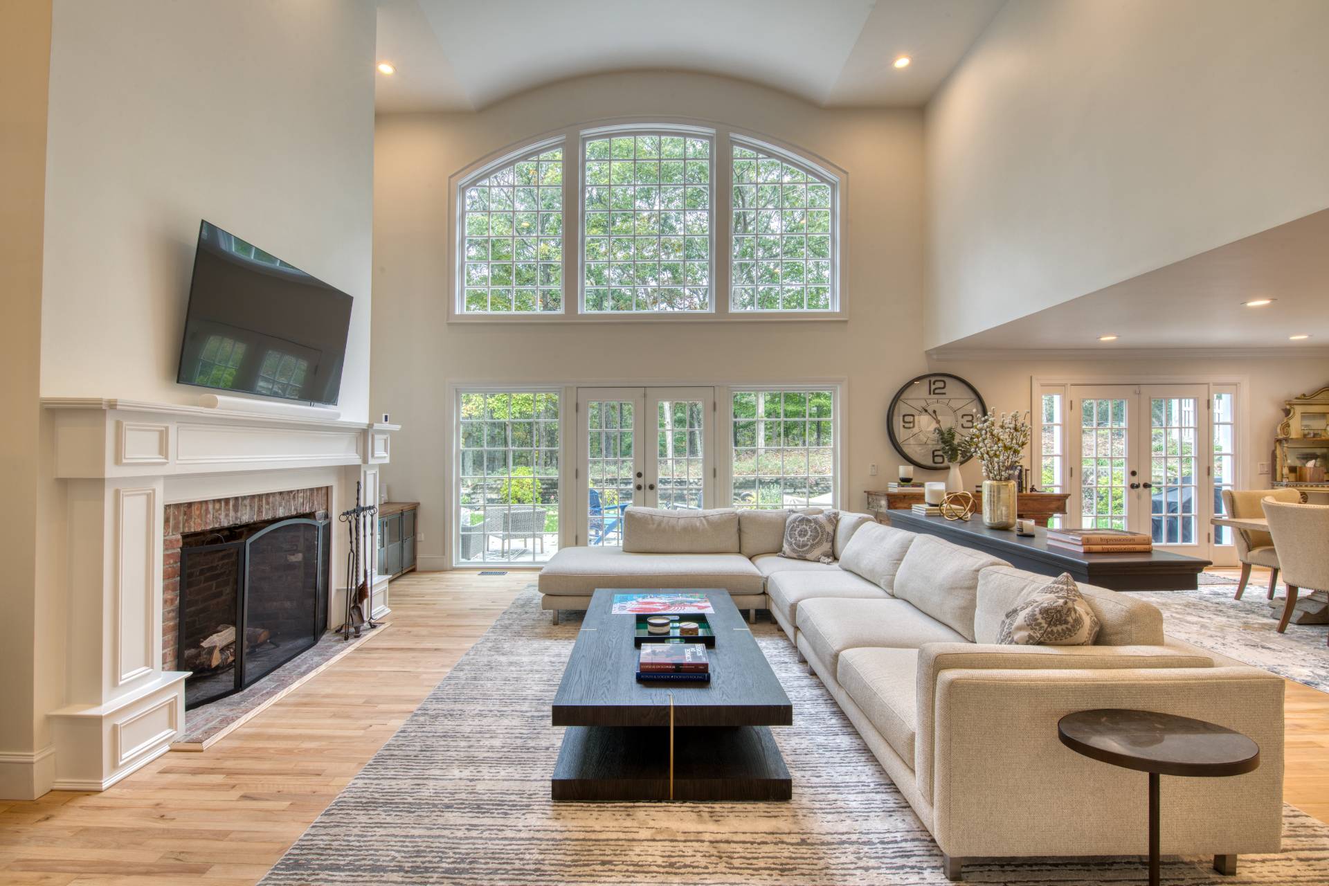 8 Grape Arbor Lane East Hampton, NY 11937 - Photo 4 of 15 a living room with furniture a fireplace and a large window