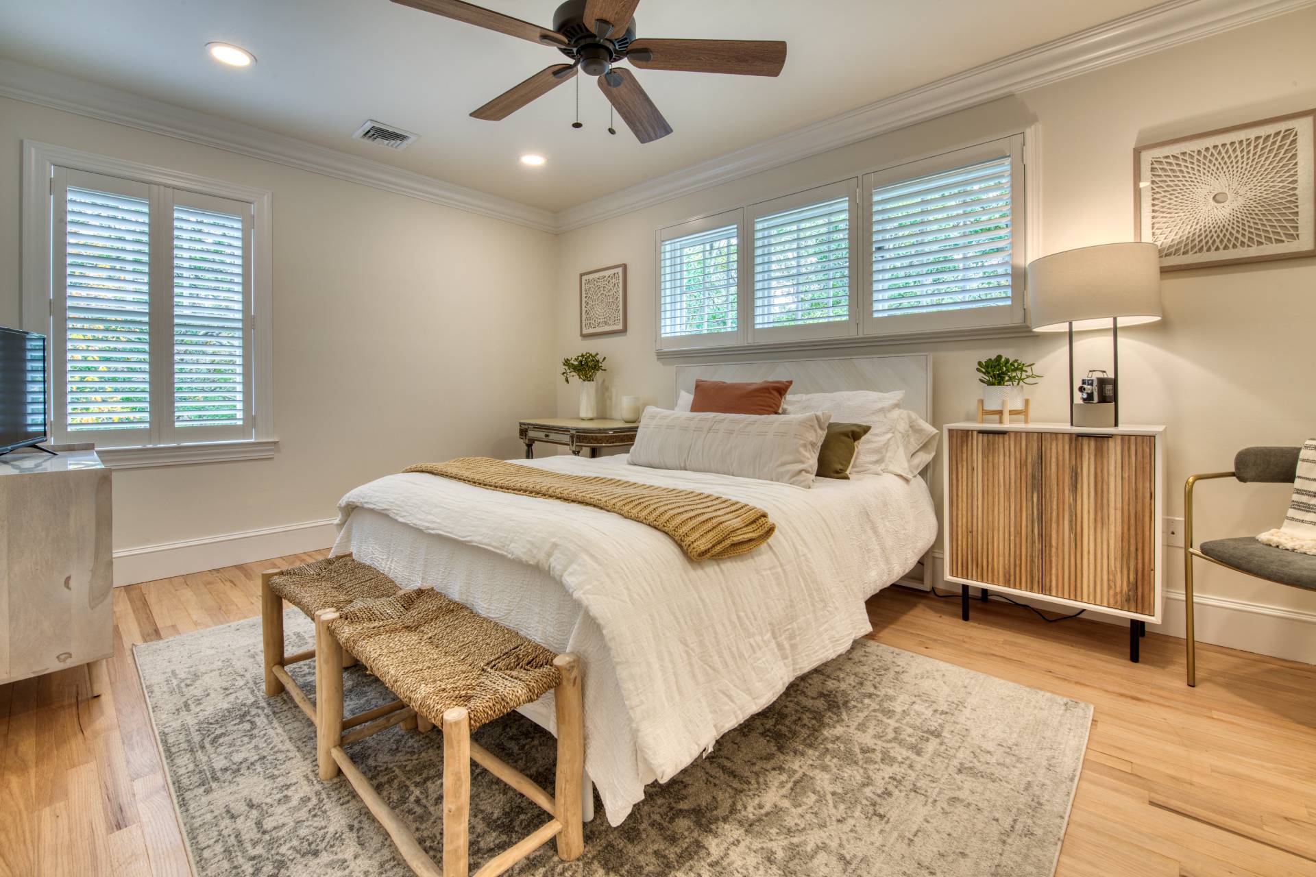 8 Grape Arbor Lane East Hampton, NY 11937 - Photo 10 of 15 a bedroom with a bed and a chandelier