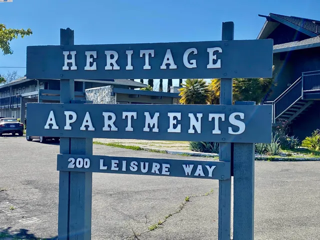 a sign on a pole on a street