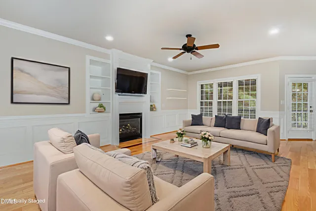 a kitchen with stainless steel appliances granite countertop wooden cabinets a stove top oven a sink and dishwasher