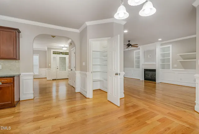 a kitchen with stainless steel appliances granite countertop a sink and a refrigerator