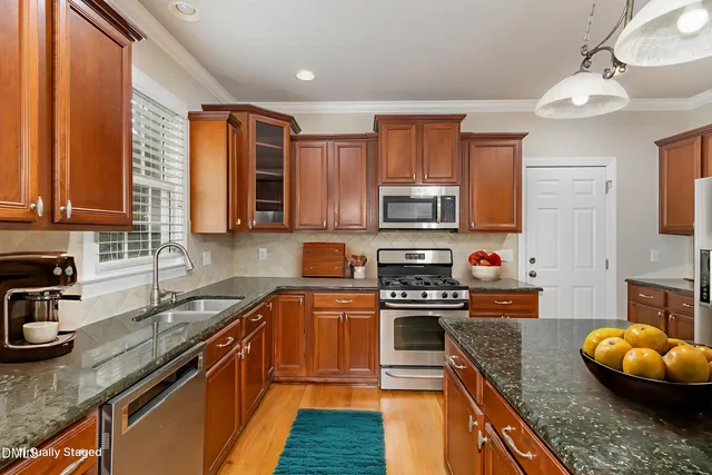 a bedroom with a large bed and a flat screen tv
