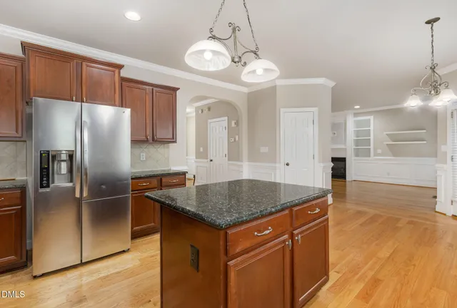 a bathroom with a shower sink and mirror