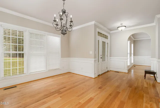 a bathroom with a double vanity sink toilet mirror and bathtub