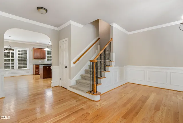 a bathroom with a tub a sink and mirror