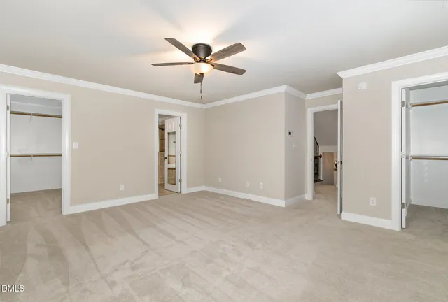 a view of a chair and table in backyard of the house
