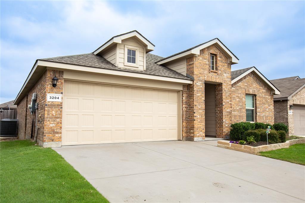 3204 Quiet Valley Road Fort Worth, TX 76123 - Photo 2 of 5 Brick exterior with architectural shingles and a dormer accent