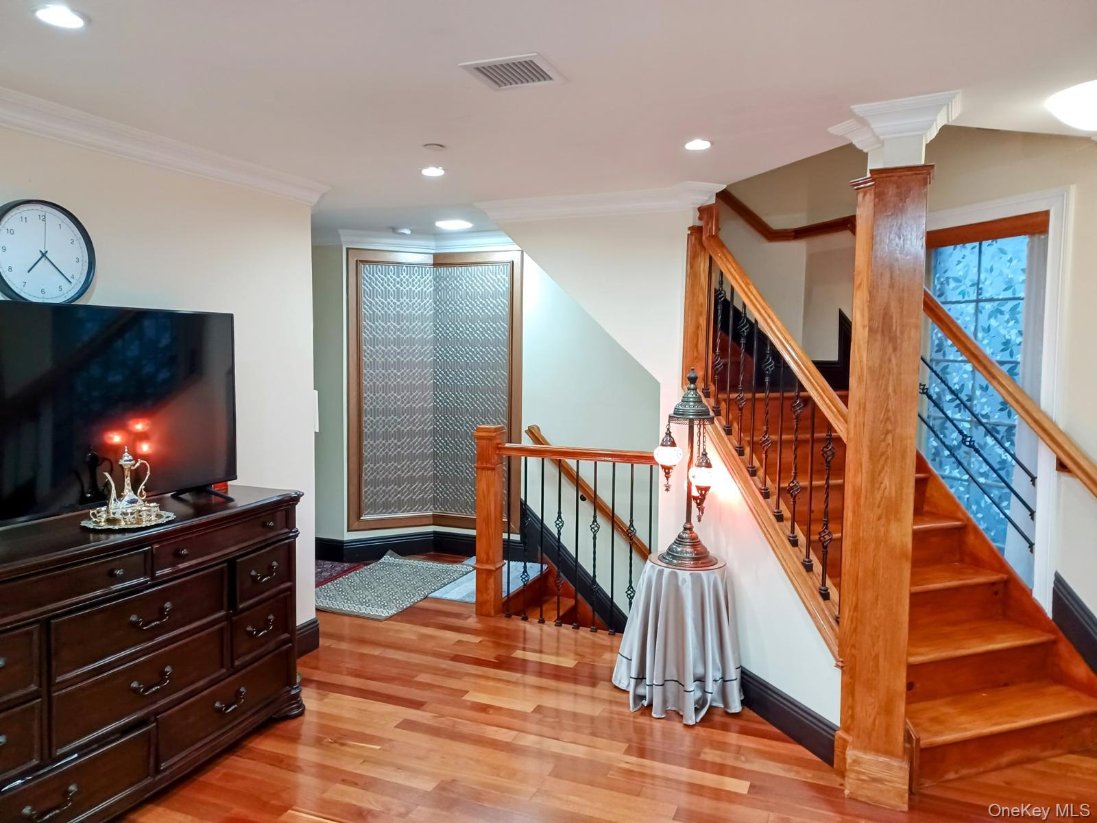 127-22 Kew Gardens Road Queens, NY 11415 - Photo 11 of 21 a view of hall way with staircase