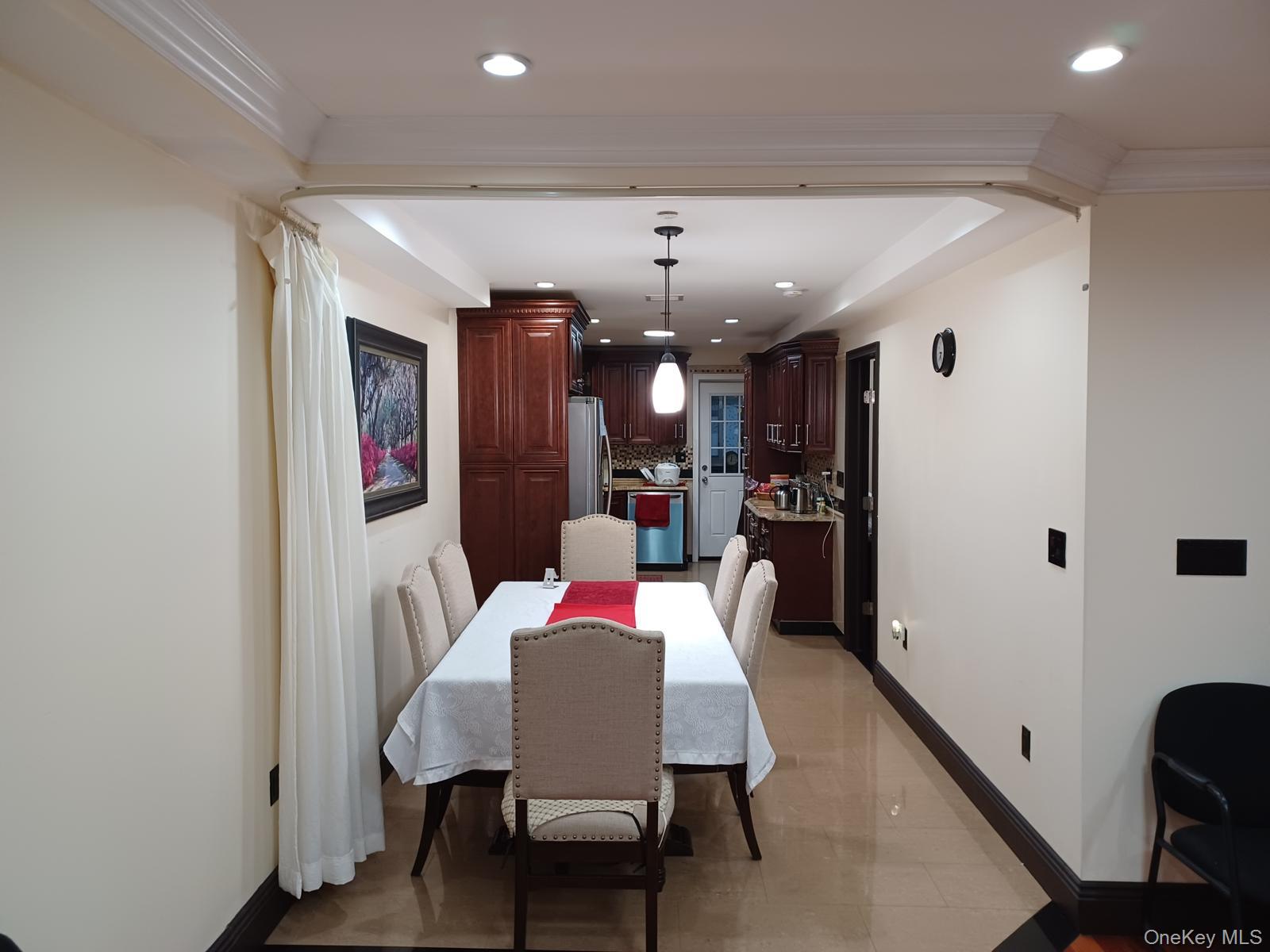 127-22 Kew Gardens Road Queens, NY 11415 - Photo 16 of 21 a dining room with furniture and window