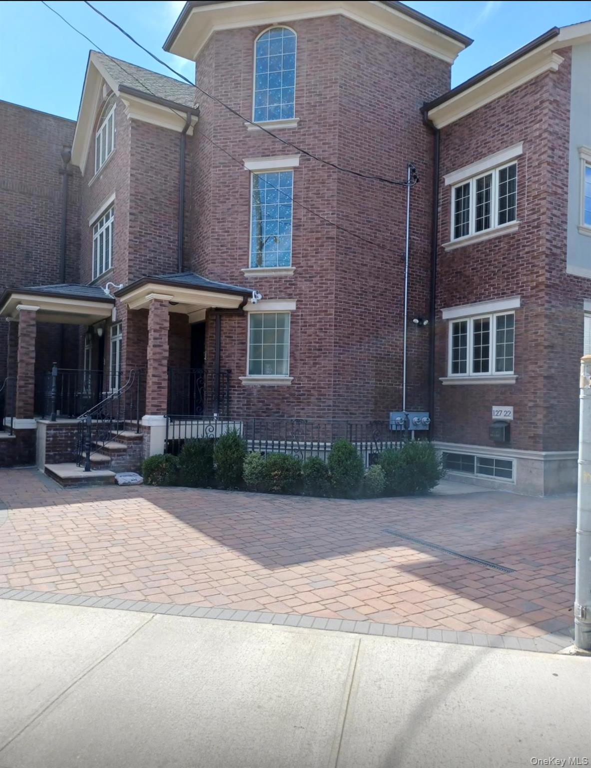 127-22 Kew Gardens Road Queens, NY 11415 - Photo 2 of 21 a front view of a house