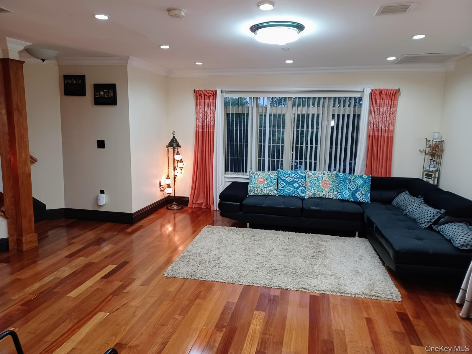 127-22 Kew Gardens Road Queens, NY 11415 - Photo 9 of 21 a living room with a bed and a table
