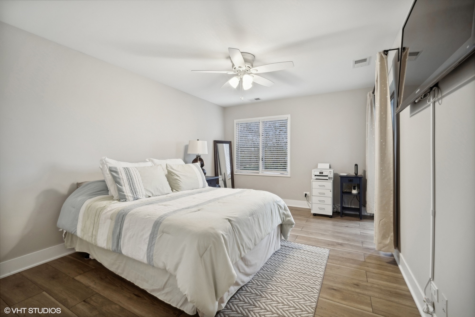 1088 Shermer Road, Unit 204 Northbrook, IL 60062 - Photo 18 of 28 a bedroom with a large bed chandelier and a window