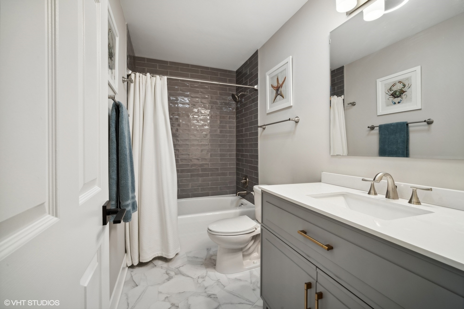1088 Shermer Road, Unit 204 Northbrook, IL 60062 - Photo 19 of 28 a bathroom with a sink a toilet and a large mirror