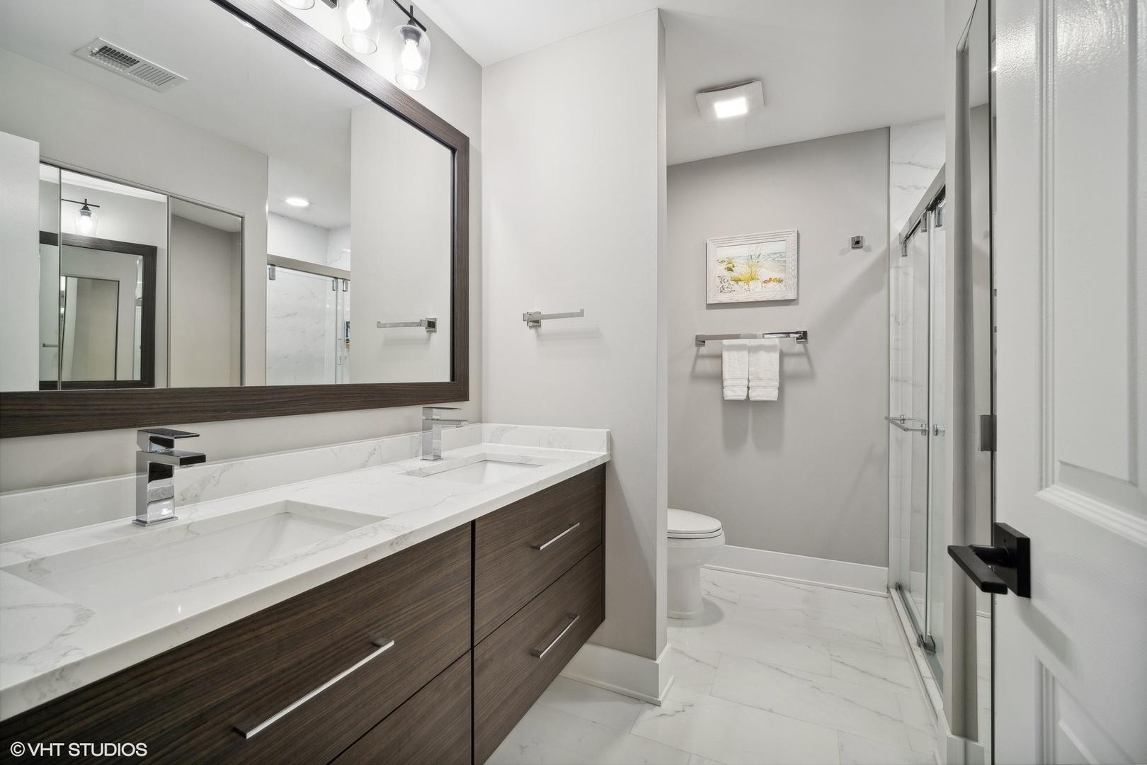 1088 Shermer Road, Unit 204 Northbrook, IL 60062 - Photo 21 of 28 a bathroom with a sink a toilet and a large mirror