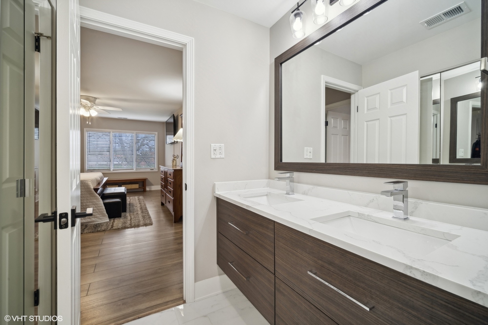 1088 Shermer Road, Unit 204 Northbrook, IL 60062 - Photo 22 of 28 a en suite bathroom with a double vanity sink and mirror