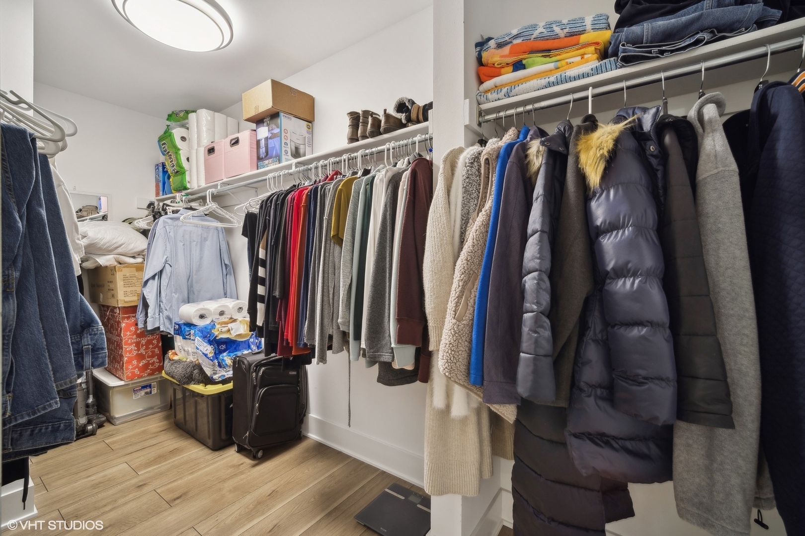 1088 Shermer Road, Unit 204 Northbrook, IL 60062 - Photo 23 of 28 a view of walk in closet with clothes and shoes