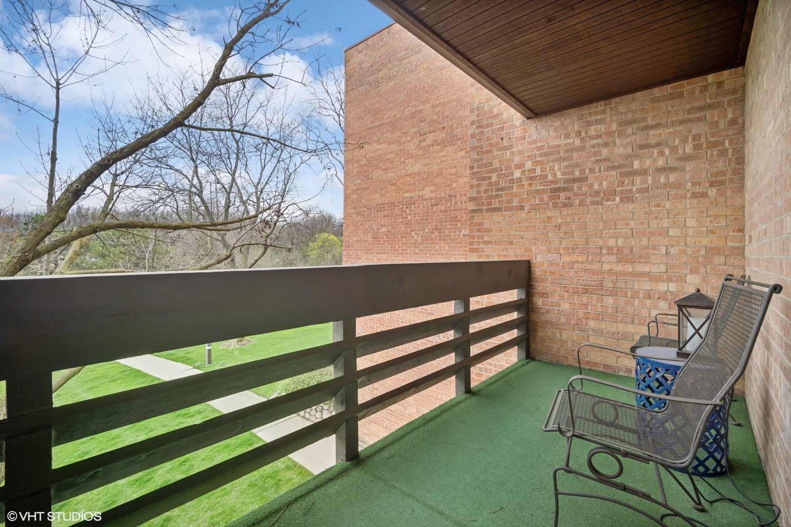 1088 Shermer Road, Unit 204 Northbrook, IL 60062 - Photo 25 of 28 a view of a bench in back yard of the house